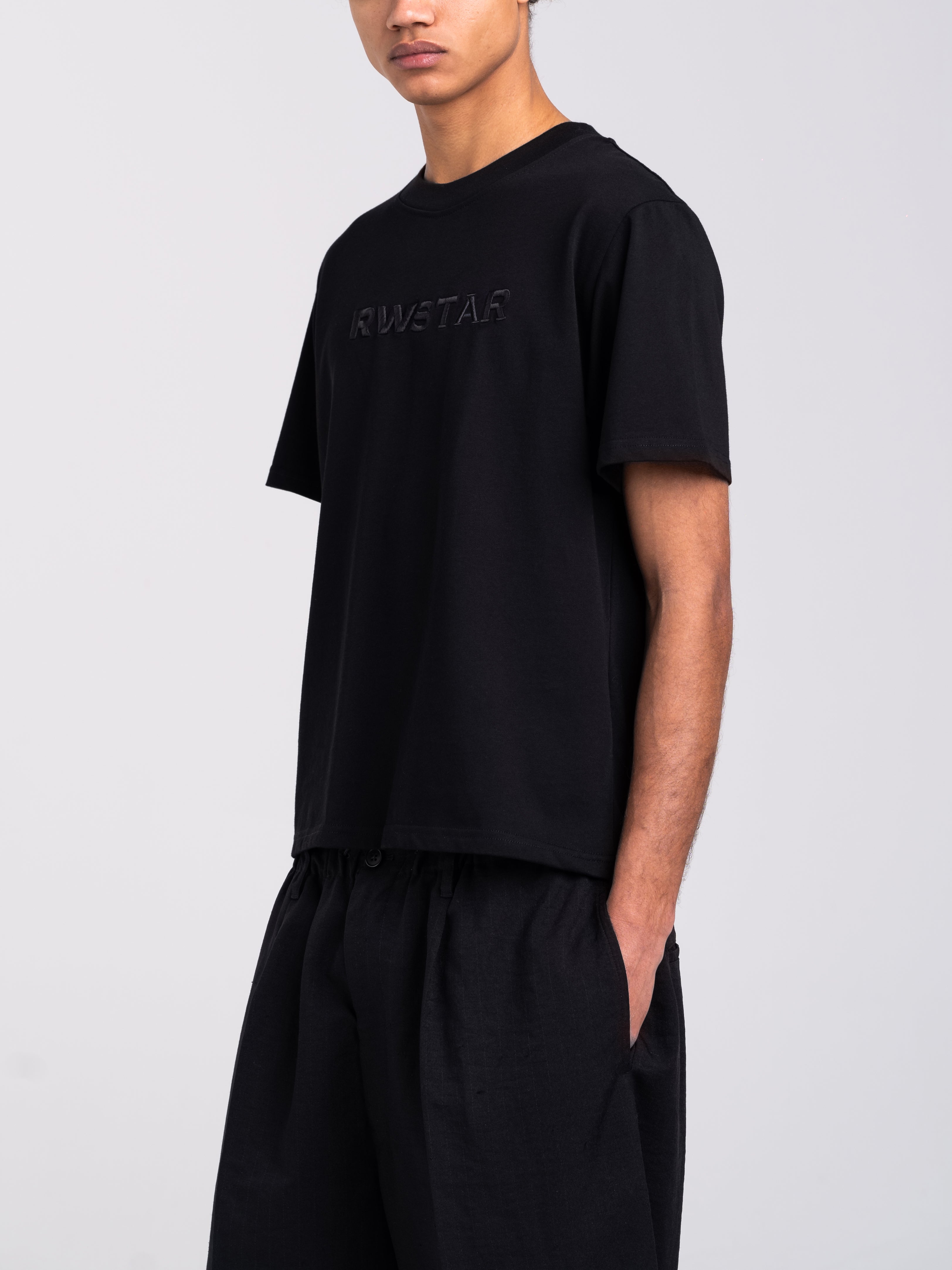 RAWSTAR Antares Acronym T-Shirt in black – model side view, premium Italian craftsmanship.