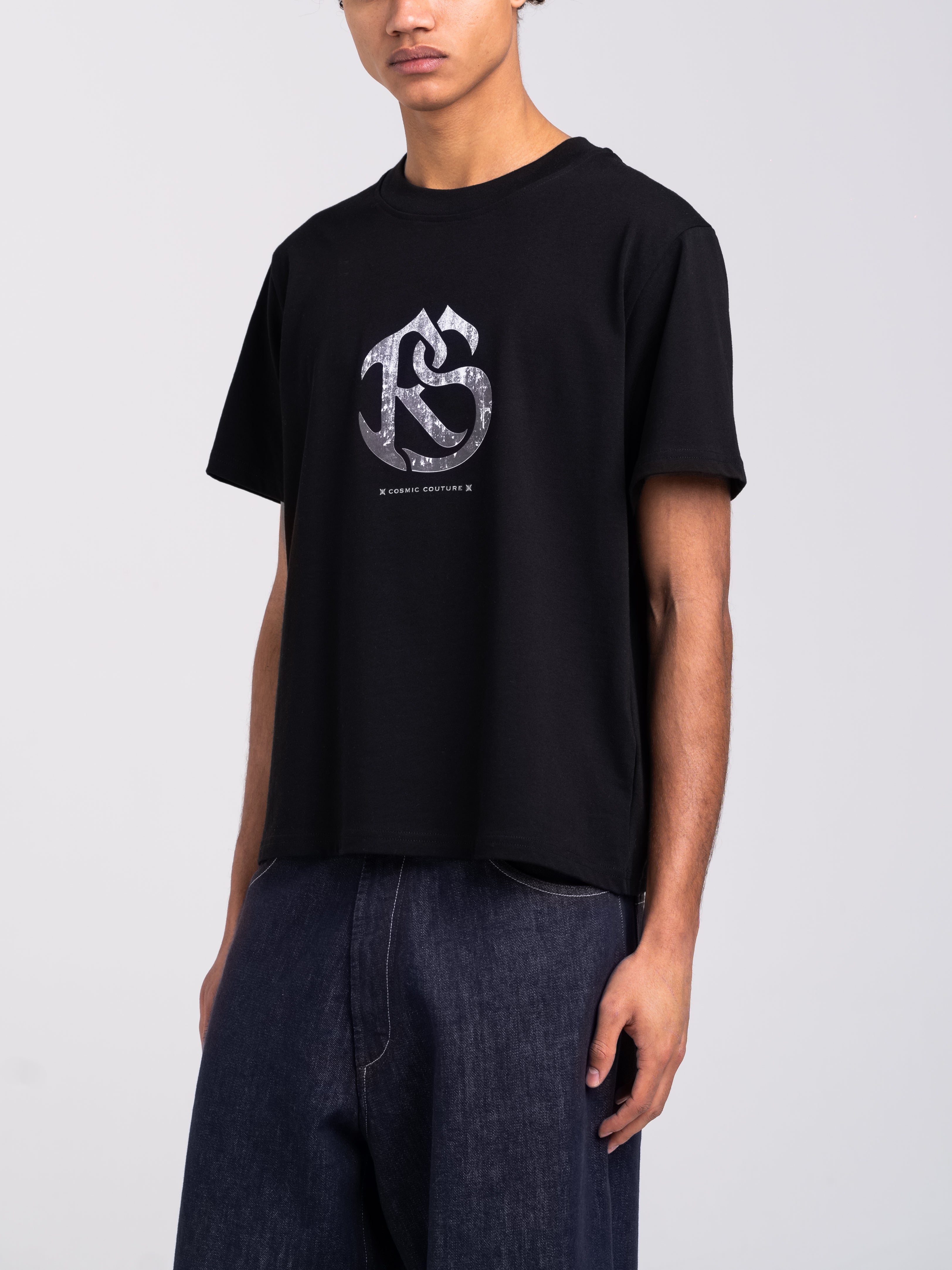 RAWSTAR Antares Astra Stellar T-Shirt in black – model wearing tee, side view showcasing premium silhouette.