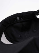 RAWSTAR Orion Trucker Hat in black – angled side view, premium streetwear, branded logo.