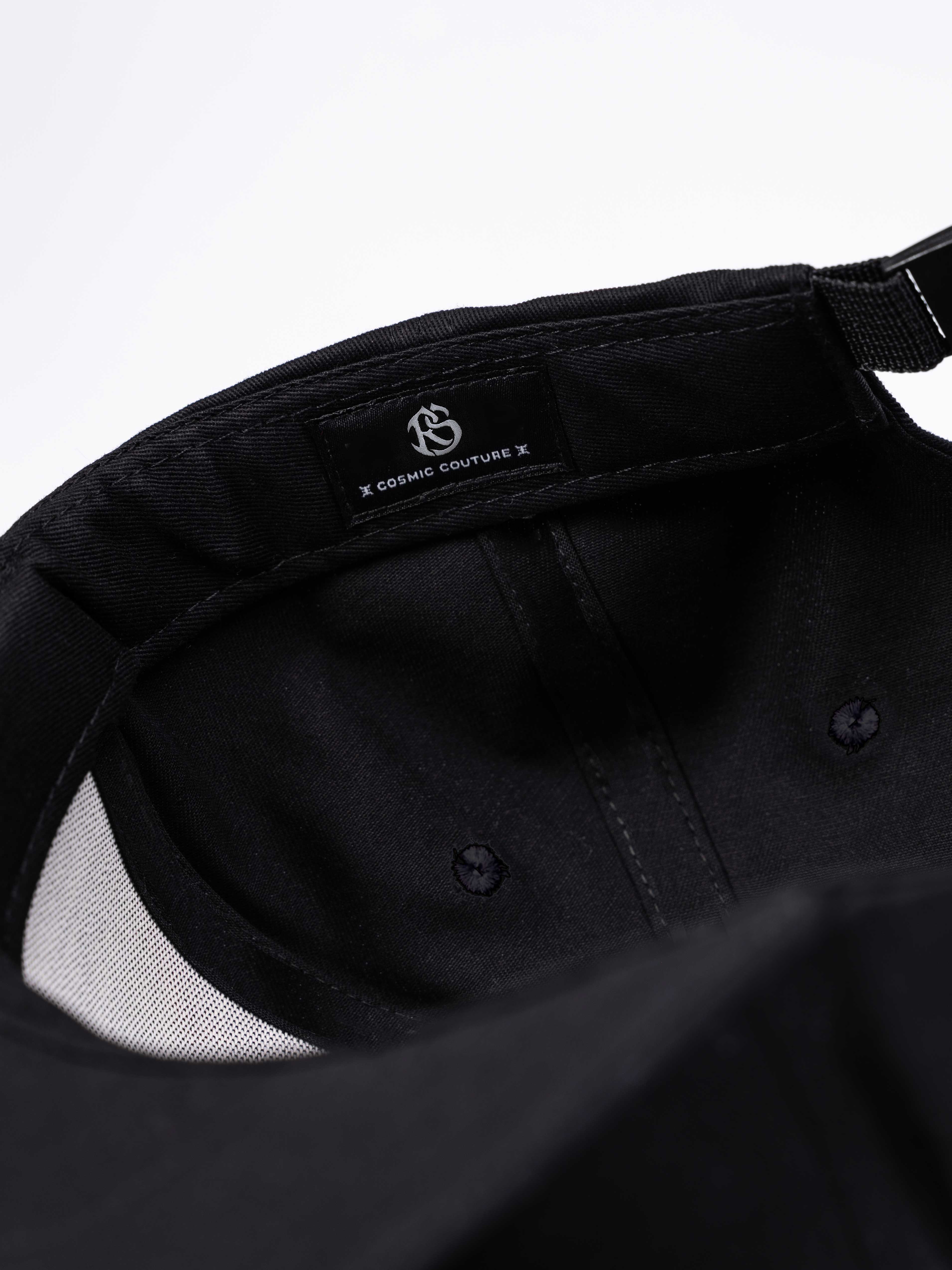 RAWSTAR Orion Trucker Hat in black – angled side view, premium streetwear, branded logo.