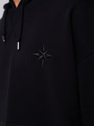 RAWSTAR Sirio Sweatshirt in black – close-up of chest embroidery star motif, limited edition luxury streetwear.