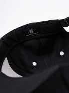 RAWSTAR Solaris Trucker Hat in black – interior label close-up “Made in Italy”, exclusive drop. Close up.